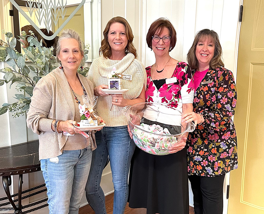 March 21, 2024 _ All smiles at March’s luncheon from the March door prize winners, Sandy Des Autels and Michelle Gysin, and door prize organizers, Vicki Burkley and Tina Scamardi. (Photo credit: Nancy Lichtle)